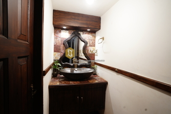 Handcrafted teak wash counter in Kochi