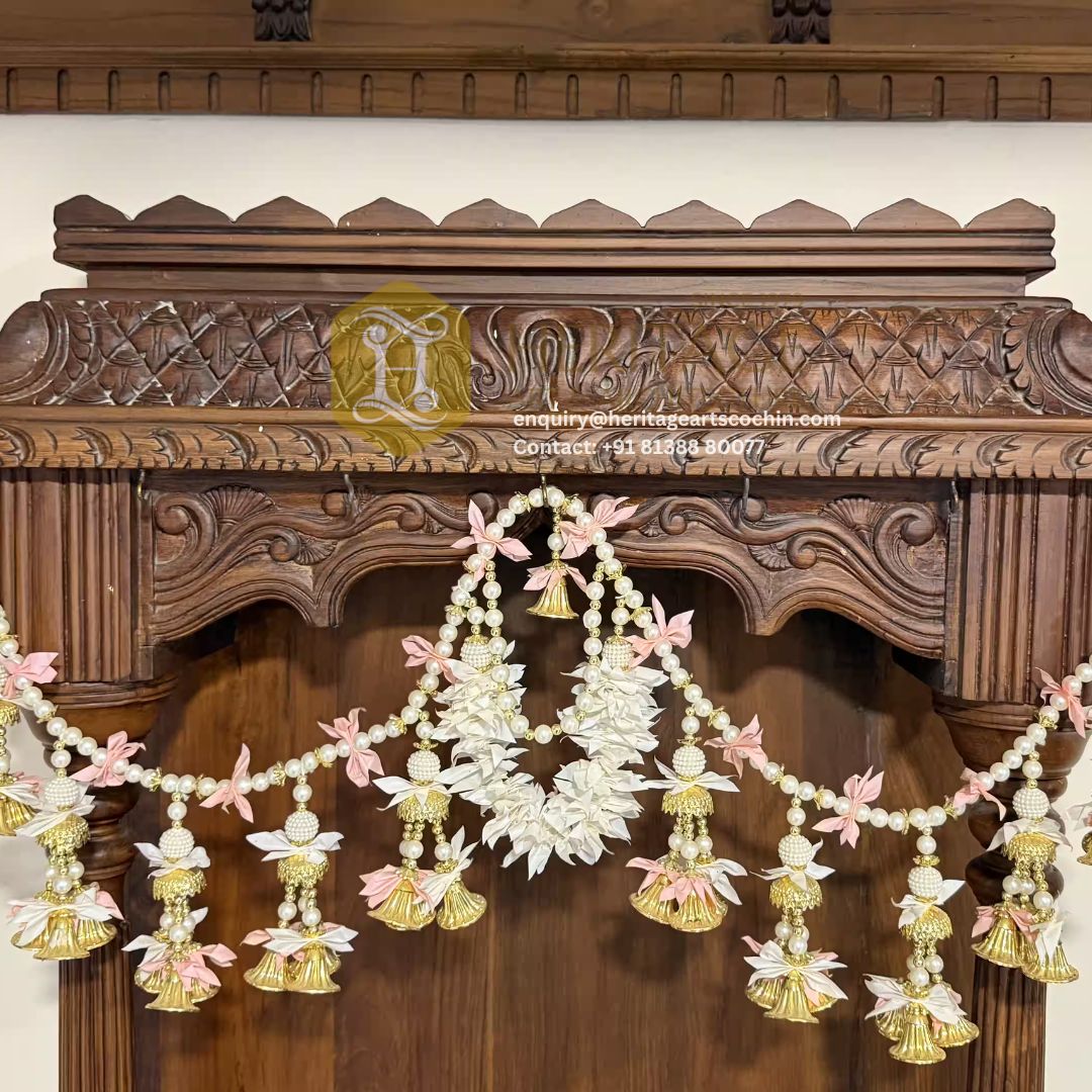 Traditional wooden pooja mandap with floral decorations in India