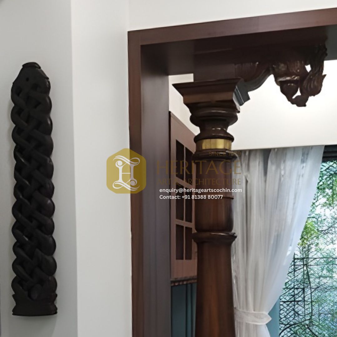 ornate wooden entrance pillar in kerala