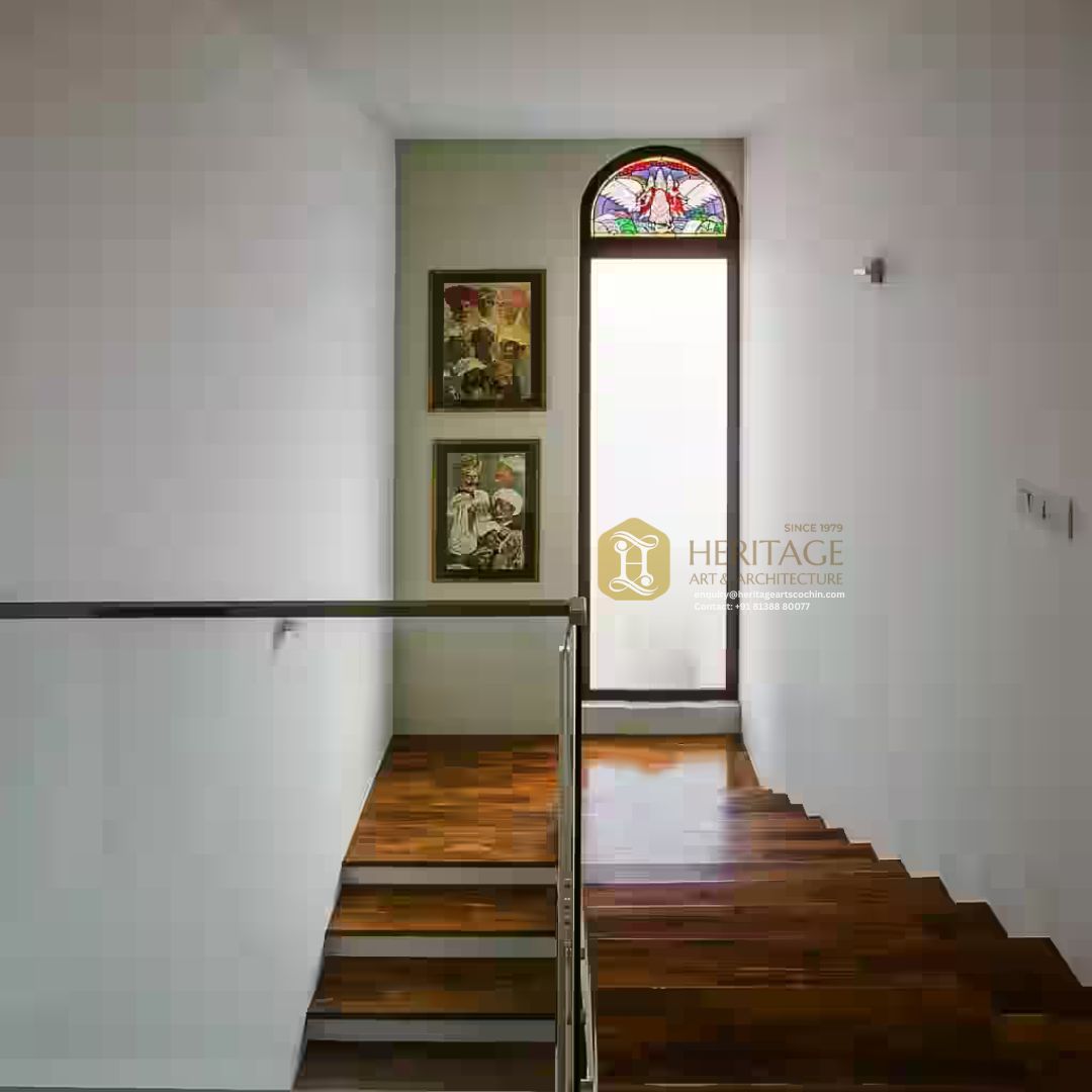 wooden staircase with glass railing kerala