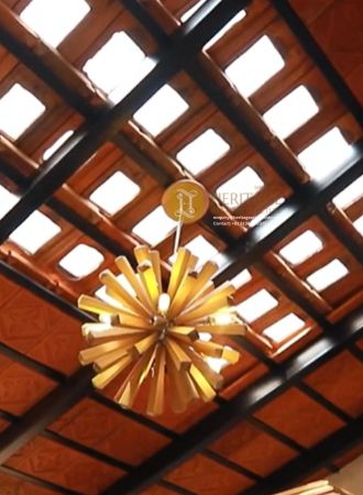 handcrafted wooden window with heritage design in kerala